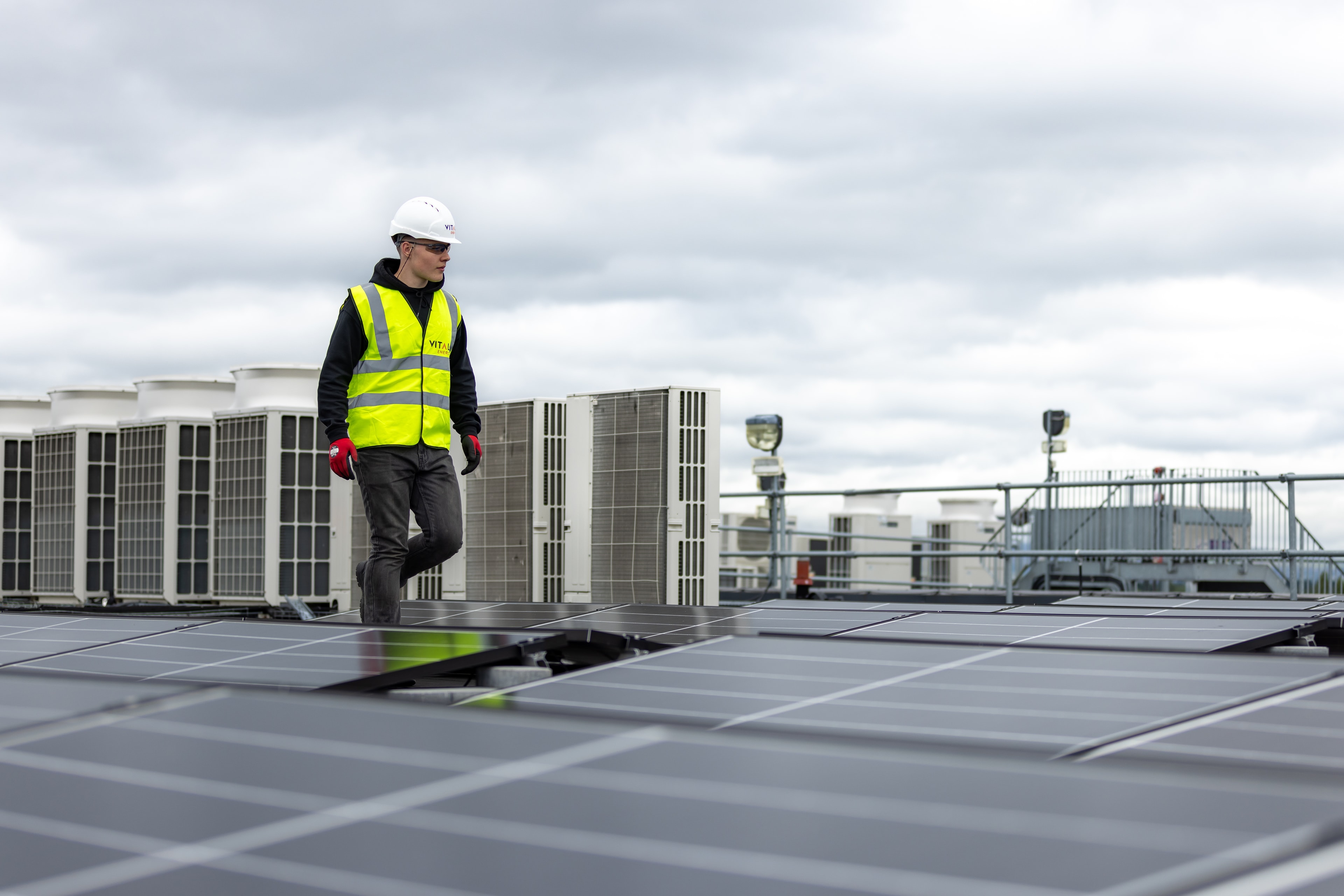 Solar installer working on a rooftop solar system